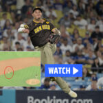 Manny Machado throws ball at dugout