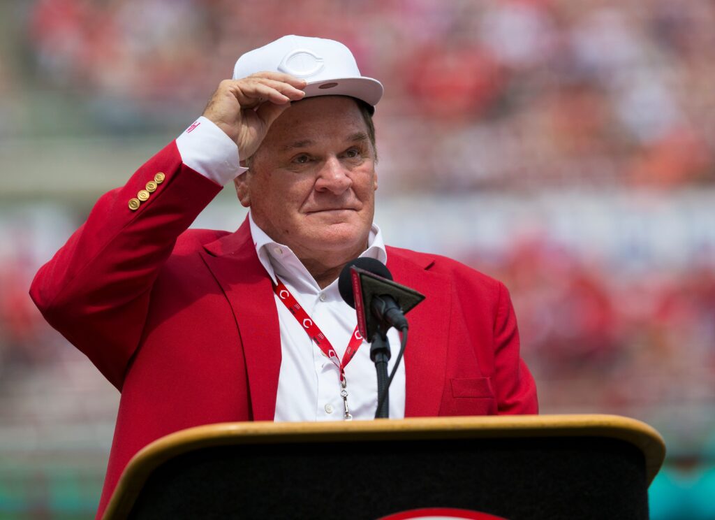 An emotional Cincinnati Reds hall of famer Pete Rose adjusts his cap as he takes the microphone during a pregame ceremony for the unveiling of Pete Rose's bronze statue being installed outside the stadium before the MLB National League game between the Cincinnati Reds and the Los Angeles Dodgers at Great American Ball Park in downtown Cincinnati on Saturday, June 17, 2017.