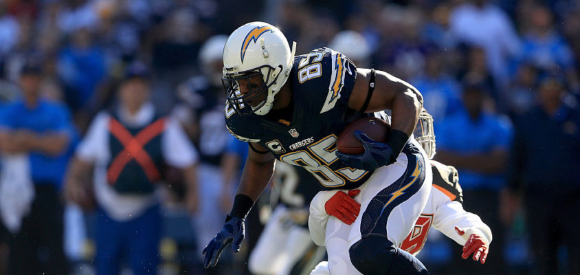 Antonio Gates #85 of the San Diego Chargers is pulled down by Kwon Alexander #58 of the Tampa Bay Buccaneers during the first half at Qualcomm Stadium on December 4, 2016 in San Diego, California.