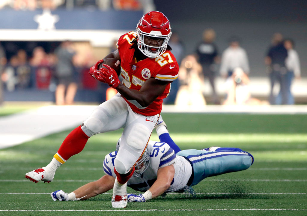 ARLINGTON, TX - NOVEMBER 05: Kareem Hunt #27 of the Kansas City Chiefs gains first down yardage against Sean Lee #50 of the Dallas Cowboys in the second quarter of a football game at AT&T Stadium on November 5, 2017 in Arlington, Texas.