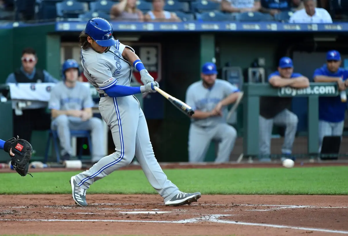 KANSAS CITY, MISSOURI - JULY 29: Bo Bichette #11 of the Toronto Blue Jays get his first Major League hit in the first inning against the Kansas City Royals at Kauffman Stadium on July 29, 2019 in Kansas City, Missouri