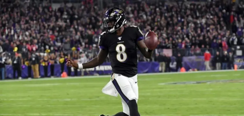 Lamar Jackson em ação pelo Baltimore Ravens vs New England Patriots pela semana 9 da NFL