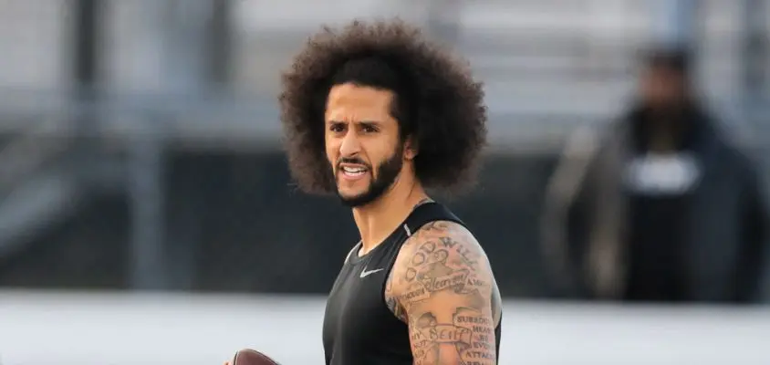 RIVERDALE, GA - NOVEMBER 16: Colin Kaepernick looks to make a pass during a private NFL workout held at Charles R Drew high school on November 16, 2019 in Riverdale, Georgia. Due to disagreements between Kaepernick and the NFL the location of the workout was abruptly changed.