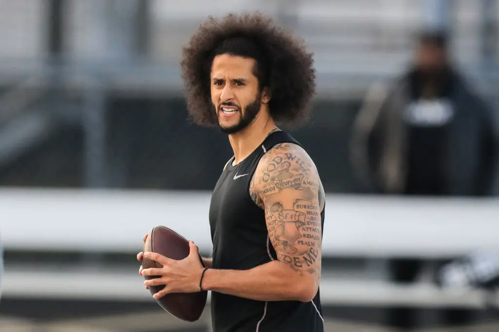 RIVERDALE, GA - NOVEMBER 16: Colin Kaepernick looks to make a pass during a private NFL workout held at Charles R Drew high school on November 16, 2019 in Riverdale, Georgia. Due to disagreements between Kaepernick and the NFL the location of the workout was abruptly changed.