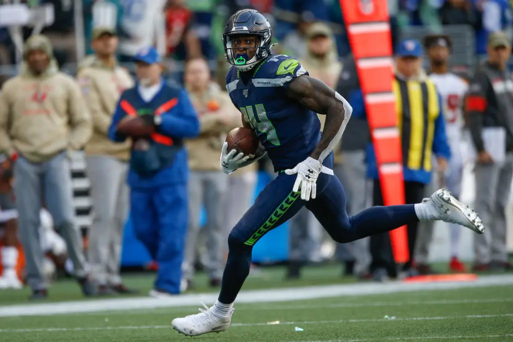 SEATTLE, WA - NOVEMBER 03: Wide receiver DK Metcalf #14 of the Seattle Seahawks rushes for a touchdown in the second half against the Tampa Bay Buccaneers at CenturyLink Field on November 3, 2019 in Seattle, Washington. The Seahawks beat the Buccaneers 40-34 in overtime