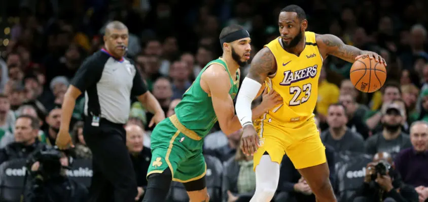 BOSTON, MASSACHUSETTS - JANUARY 20: Jayson Tatum #0 of the Boston Celtics defends LeBron James #23 of the Los Angeles Lakers at TD Garden on January 20, 2020 in Boston, Massachusetts. The Celtics defeat the Lakers 139-107