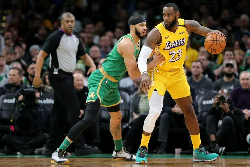 BOSTON, MASSACHUSETTS - JANUARY 20: Jayson Tatum #0 of the Boston Celtics defends LeBron James #23 of the Los Angeles Lakers at TD Garden on January 20, 2020 in Boston, Massachusetts. The Celtics defeat the Lakers 139-107