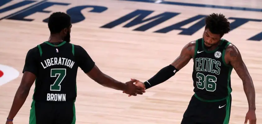 LAKE BUENA VISTA, FLORIDA - SEPTEMBER 11: Jaylen Brown #7 of the Boston Celtics and Marcus Smart #36 of the Boston Celtics react during the fourth quarter against the Toronto Raptors in Game Seven of the Eastern Conference Second Round during the 2020 NBA Playoffs at AdventHealth Arena at the ESPN Wide World Of Sports Complex on September 11, 2020 in Lake Buena Vista, Florida