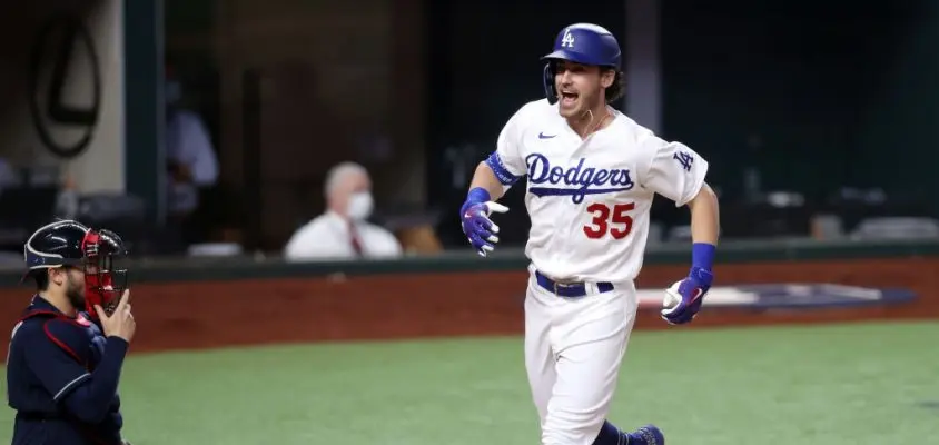 ARLINGTON, TEXAS - OCTOBER 18: Cody Bellinger #35 of the Los Angeles Dodgers crosses home plate after hitting a solo home run against the Atlanta Braves during the seventh inning in Game Seven of the National League Championship Series at Globe Life Field on October 18, 2020 in Arlington, Texas