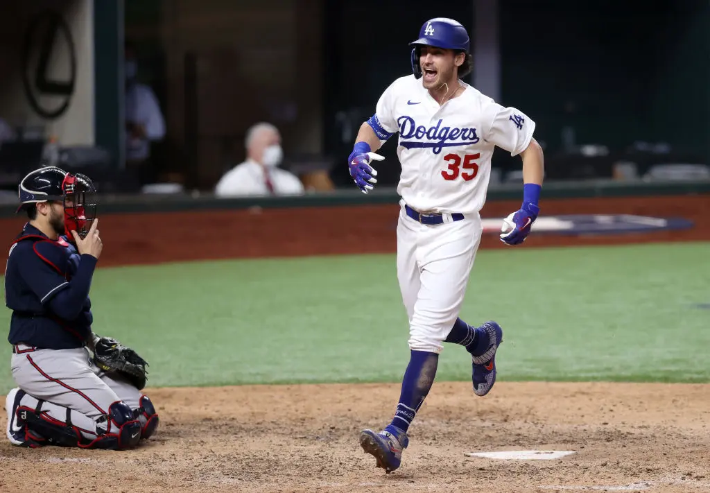 ARLINGTON, TEXAS - OCTOBER 18: Cody Bellinger #35 of the Los Angeles Dodgers crosses home plate after hitting a solo home run against the Atlanta Braves during the seventh inning in Game Seven of the National League Championship Series at Globe Life Field on October 18, 2020 in Arlington, Texas