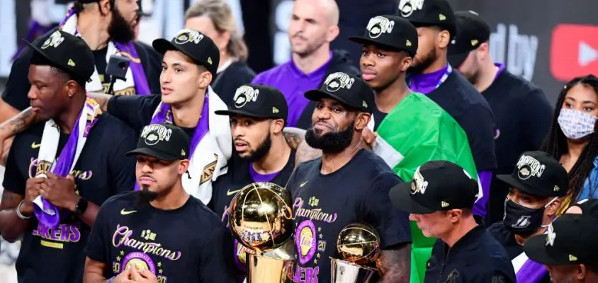 LAKE BUENA VISTA, FLORIDA - OCTOBER 11: LeBron James #23 of the Los Angeles Lakers reacts with his MVP trophy and Finals trophy after winning the 2020 NBA Championship over the Miami Heat in Game Six of the 2020 NBA Finals at AdventHealth Arena at the ESPN Wide World Of Sports Complex on October 11, 2020 in Lake Buena Vista, Florida