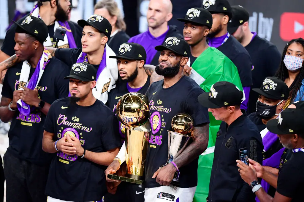 LAKE BUENA VISTA, FLORIDA - OCTOBER 11: LeBron James #23 of the Los Angeles Lakers reacts with his MVP trophy and Finals trophy after winning the 2020 NBA Championship over the Miami Heat in Game Six of the 2020 NBA Finals at AdventHealth Arena at the ESPN Wide World Of Sports Complex on October 11, 2020 in Lake Buena Vista, Florida