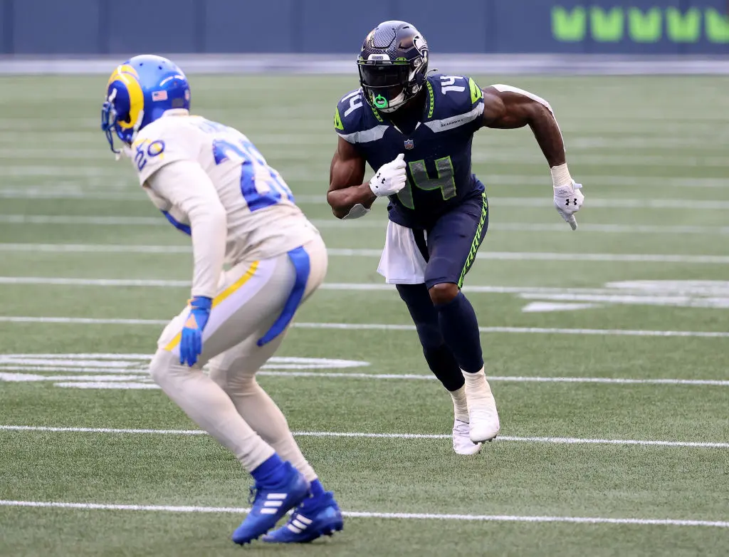 SEATTLE, WASHINGTON - DECEMBER 27: DK Metcalf #14 of the Seattle Seahawks and Jalen Ramsey #20 of the Los Angeles Rams in action during the second quarter at Lumen Field on December 27, 2020 in Seattle, Washington.