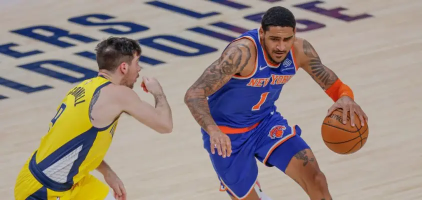 INDIANAPOLIS, IN - DECEMBER 23: Obi Toppin #1 of the New York Knicks brings the ball up court against T.J. McConnell #9 of the Indiana Pacers at Bankers Life Fieldhouse on December 23, 2020 in Indianapolis, Indiana