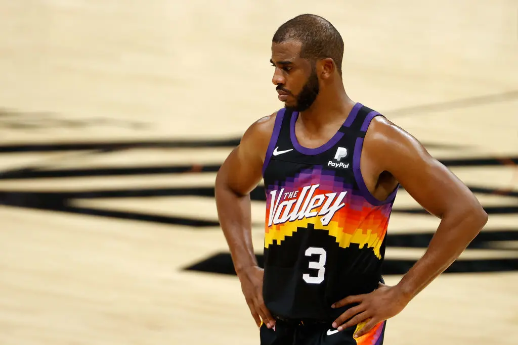 PHOENIX, ARIZONA - JANUARY 23: Chris Paul #3 of the Phoenix Suns reacts during overtime of the NBA game against the Denver Nuggets at Phoenix Suns Arena on January 23, 2021 in Phoenix, Arizona. The Nuggets defeated the Suns 120-112