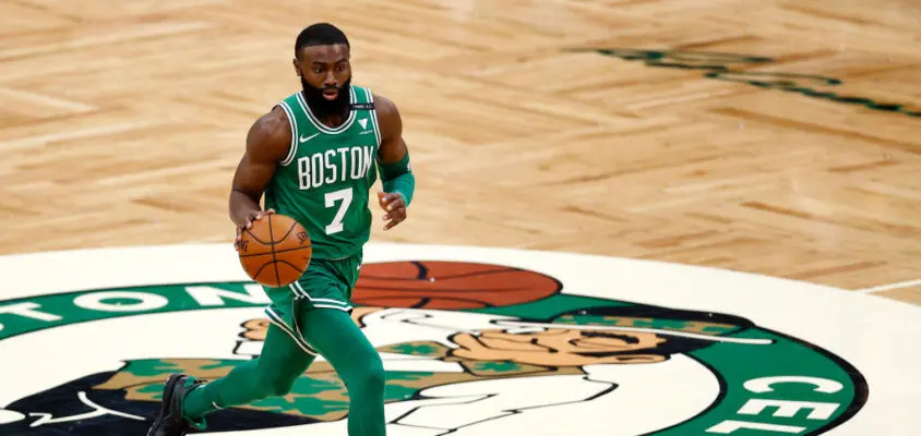 BOSTON, MASSACHUSETTS - FEBRUARY 17: Jaylen Brown #7 of the Boston Celtics dribbles downcourt during the second half against the Atlanta Hawksat TD Garden on February 17, 2021 in Boston, Massachusetts