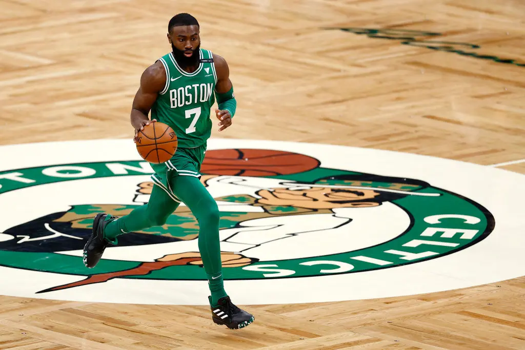 BOSTON, MASSACHUSETTS - FEBRUARY 17: Jaylen Brown #7 of the Boston Celtics dribbles downcourt during the second half against the Atlanta Hawksat TD Garden on February 17, 2021 in Boston, Massachusetts