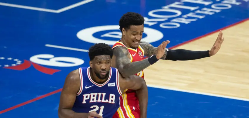 PHILADELPHIA, PA - APRIL 30: Joel Embiid #21 of the Philadelphia 76ers battles with John Collins #20 of the Atlanta Hawks in the second quarter at the Wells Fargo Center on April 30, 2021 in Philadelphia, Pennsylvania