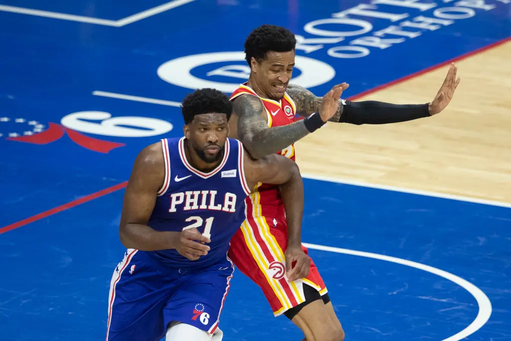 PHILADELPHIA, PA - APRIL 30: Joel Embiid #21 of the Philadelphia 76ers battles with John Collins #20 of the Atlanta Hawks in the second quarter at the Wells Fargo Center on April 30, 2021 in Philadelphia, Pennsylvania