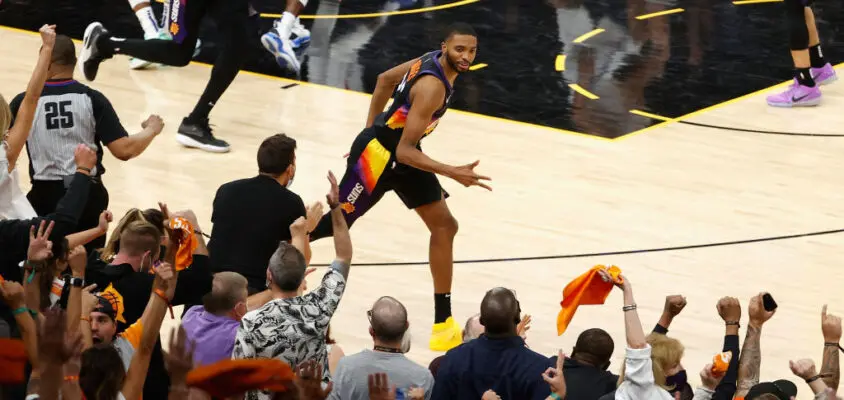 PHOENIX, ARIZONA - JUNE 20: Mikal Bridges #25 of the Phoenix Suns reacts to a three-point shot against the LA Clippers during the second half of game one of the Western Conference Finals at Phoenix Suns Arena on June 20, 2021 in Phoenix, Arizona. The Suns defeated the Clippers 120-114.