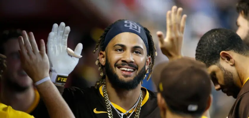 PHOENIX, ARIZONA - AUGUST 15: Fernando Tatis Jr #23 of the San Diego Padres is congratulated by teammates after hitting a solo home run against the Arizona Diamondbacks during the fifth inning of the MLB game at Chase Field on August 15, 2021 in Phoenix, Arizona. It was Tatis' second homer of the game