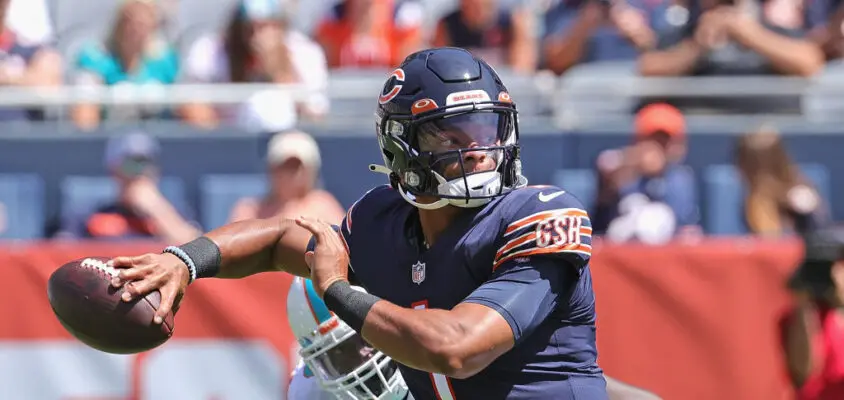 CHICAGO, ILLINOIS - AUGUST 14: Justin Fields #1 of the Chicago Bears passes against the Miami Dolphins during a preseason game at Soldier Field on August 14, 2021 in Chicago, Illinois