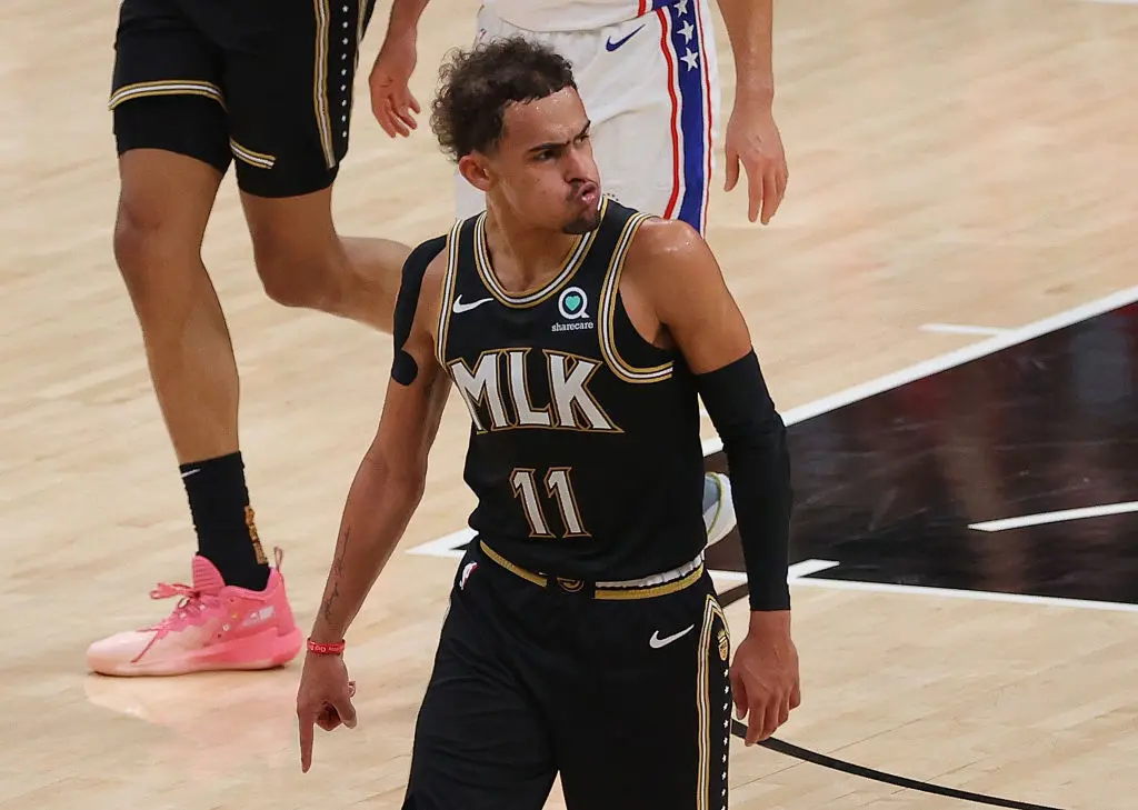 ATLANTA, GEORGIA - JUNE 18: Trae Young #11 of the Atlanta Hawks reacts after hitting a three-point basket against the Philadelphia 76ers during the first half of game 6 of the Eastern Conference Semifinals at State Farm Arena on June 18, 2021 in Atlanta, Georgia.