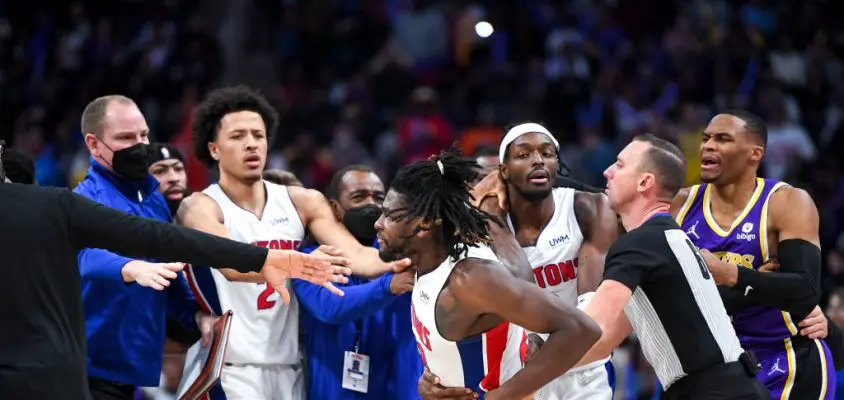 DETROIT, MICHIGAN - NOVEMBER 21: Isaiah Stewart #28 of the Detroit Pistons is restrained as he goes after LeBron James #6 of the Los Angeles Lakers during the third quarter of the game at Little Caesars Arena on November 21, 2021 in Detroit, Michigan.