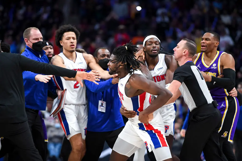 DETROIT, MICHIGAN - NOVEMBER 21: Isaiah Stewart #28 of the Detroit Pistons is restrained as he goes after LeBron James #6 of the Los Angeles Lakers during the third quarter of the game at Little Caesars Arena on November 21, 2021 in Detroit, Michigan.