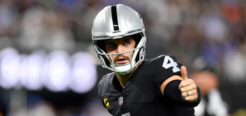 LAS VEGAS, NEVADA - JANUARY 09: Quarterback Derek Carr #4 of the Las Vegas Raiders lines up for a play against the Los Angeles Chargers during the first half of a game at Allegiant Stadium on January 09, 2022 in Las Vegas, Nevada. The Raiders defeated the Chargers 35-32 in overtime