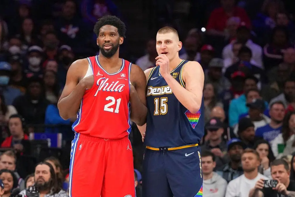 PHILADELPHIA, PA - MARCH 14: Joel Embiid #21 of the Philadelphia 76ers talks to Nikola Jokic #15 of the Denver Nuggets at the Wells Fargo Center on March 14, 2022 in Philadelphia, Pennsylvania. The Nuggets defeated the 76ers 114-110