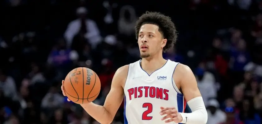 DETROIT, MICHIGAN - MARCH 23: Cade Cunningham #2 of the Detroit Pistons handles the ball against the Atlanta Hawks at Little Caesars Arena on March 23, 2022 in Detroit, Michigan