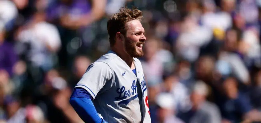 DENVER, CO - APRIL 8: Gavin Lux #9 of the Los Angeles Dodgers smiles on his way to the dugout after scoring on a double off the bat of Mookie Betts in the fourth inning against the Colorado Rockies on Opening Day at Coors Field on April 8, 2022 in Denver, Colorado