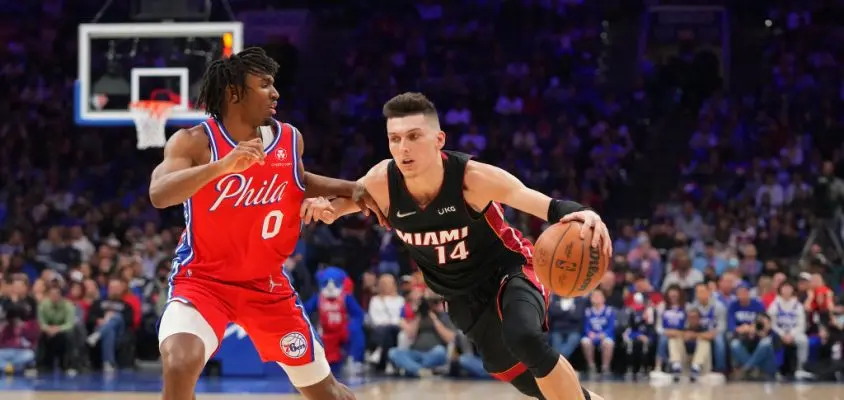 PHILADELPHIA, PA - MARCH 21: Tyler Herro #14 of the Miami Heat drives to the basket against Tyrese Maxey #0 of the Philadelphia 76ers in the second half at the Wells Fargo Center on March 21, 2022 in Philadelphia, Pennsylvania. The 76ers defeated the Heat 113-106