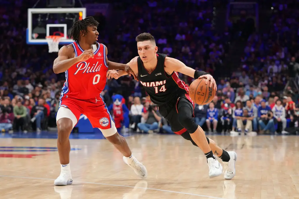 PHILADELPHIA, PA - MARCH 21: Tyler Herro #14 of the Miami Heat drives to the basket against Tyrese Maxey #0 of the Philadelphia 76ers in the second half at the Wells Fargo Center on March 21, 2022 in Philadelphia, Pennsylvania. The 76ers defeated the Heat 113-106