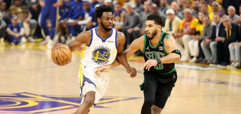 SAN FRANCISCO, CALIFORNIA - JUNE 13: Andrew Wiggins #22 of the Golden State Warriors brings the ball up court against Jayson Tatum #0 of the Boston Celtics during the first quarter in Game Five of the 2022 NBA Finals at Chase Center on June 13, 2022 in San Francisco, California