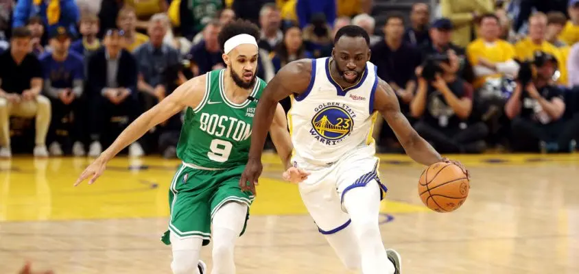 SAN FRANCISCO, CALIFORNIA - JUNE 02: Draymond Green #23 of the Golden State Warriors dribbles against Derrick White #9 of the Boston Celtics during the first quarter in Game One of the 2022 NBA Finals at Chase Center on June 02, 2022 in San Francisco, California.