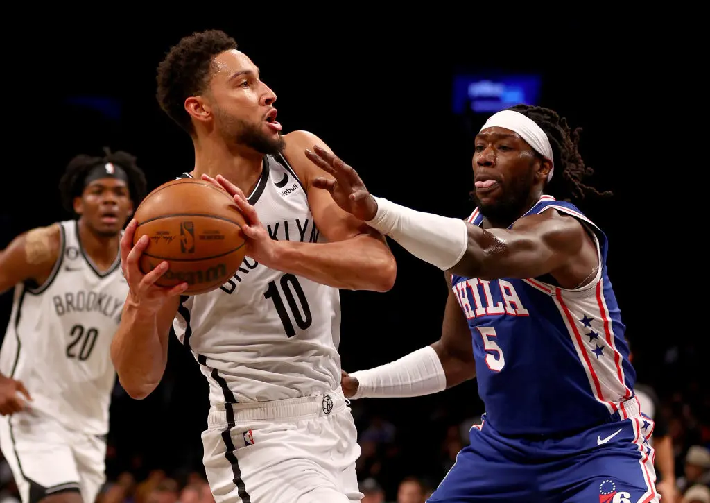 NEW YORK, NEW YORK - OCTOBER 03: Ben Simmons #10 of the Brooklyn Nets tries to keep the ball from Montrezl Harrell #5 of the Philadelphia 76ers in the first half during a preseason game at Barclays Center on October 03, 2022 in the Brooklyn borough of New York City.