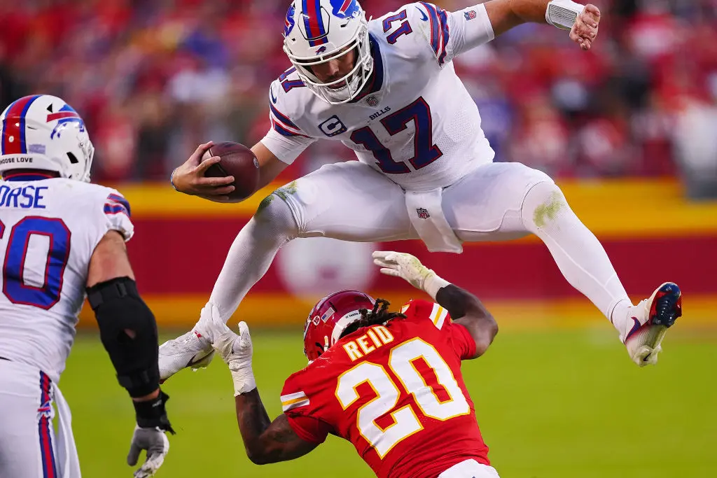 KANSAS CITY, MISSOURI - OCTOBER 16: Josh Allen #17 of the Buffalo Bills hurdles over Justin Reid #20 of the Kansas City Chiefs during the fourth quarter at Arrowhead Stadium on October 16, 2022 in Kansas City, Missouri