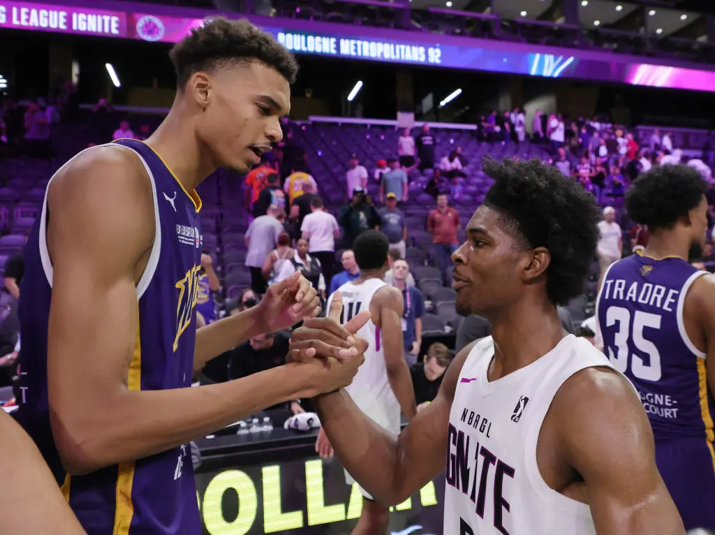 HENDERSON, NEVADA - OCTOBER 04: Victor Wembanyama #1 of Boulogne-Levallois Metropolitans 92 and Scoot Henderson #0 of G League Ignite shake hands after their exhibition game at The Dollar Loan Center on October 04, 2022 in Henderson, Nevada. Ignite defeated Metropolitans 92 122-115.