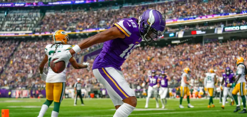 MINNEAPOLIS, MN - SEPTEMBER 11: Minnesota Vikings wide receiver Justin Jefferson (18) celebrates his first quarter 5-yard touchdown reception by doing The Griddy during an NFL game between the Minnesota Vikings and Green Bay Packers on September 11, 2022 at U.S. Bank Stadium in Minneapolis, MN