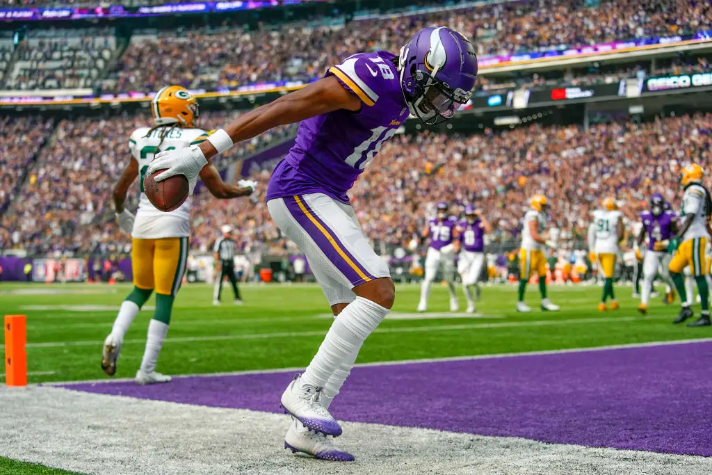 MINNEAPOLIS, MN - SEPTEMBER 11: Minnesota Vikings wide receiver Justin Jefferson (18) celebrates his first quarter 5-yard touchdown reception by doing The Griddy during an NFL game between the Minnesota Vikings and Green Bay Packers on September 11, 2022 at U.S. Bank Stadium in Minneapolis, MN