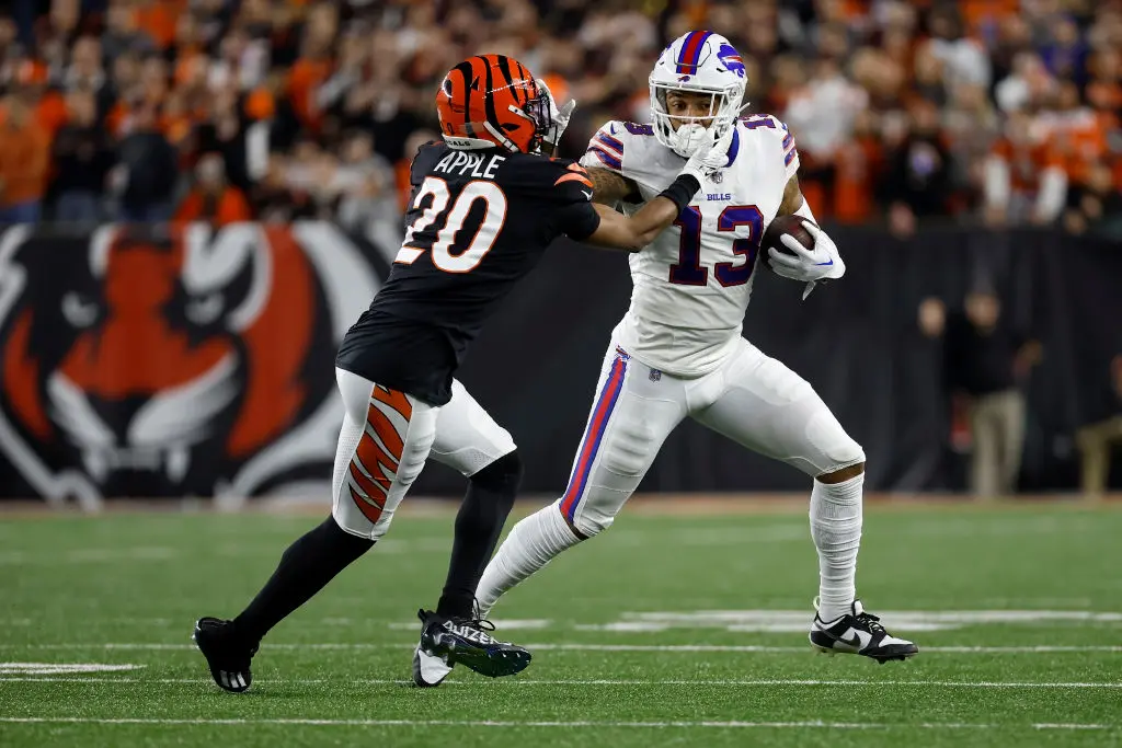 CINCINNATI, OH - JANUARY 02: Gabe Davis #13 of the Buffalo Bills attempts to run the ball past Eli Apple #20 of the Cincinnati Bengals during the game at Paycor Stadium on January 2, 2023 in Cincinnati, Ohio.