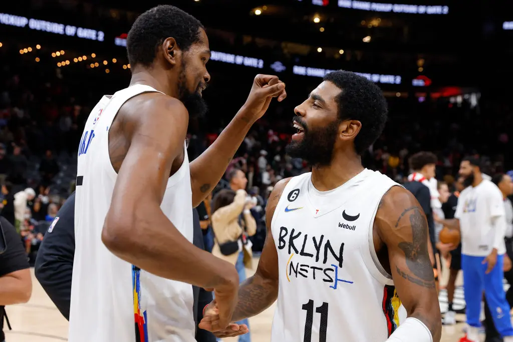 ATLANTA, GA - DECEMBER 28: Kevin Durant #7 of the Brooklyn Nets reacts withy Kyrie Irving #11 after their 108-107 victory over the Atlanta Hawks at State Farm Arena on December 28, 2022 in Atlanta, Georgia.