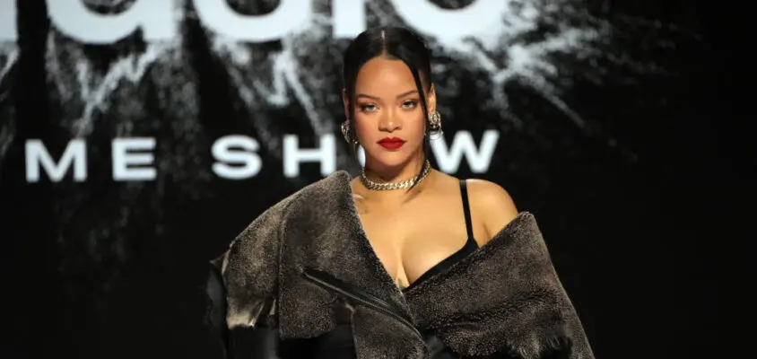 PHOENIX, ARIZONA - FEBRUARY 09: Rihanna speaks onstage during the press conference for Apple Music Super Bowl LVII Halftime Show at Phoenix Convention Center on February 09, 2023 in Phoenix, Arizona.