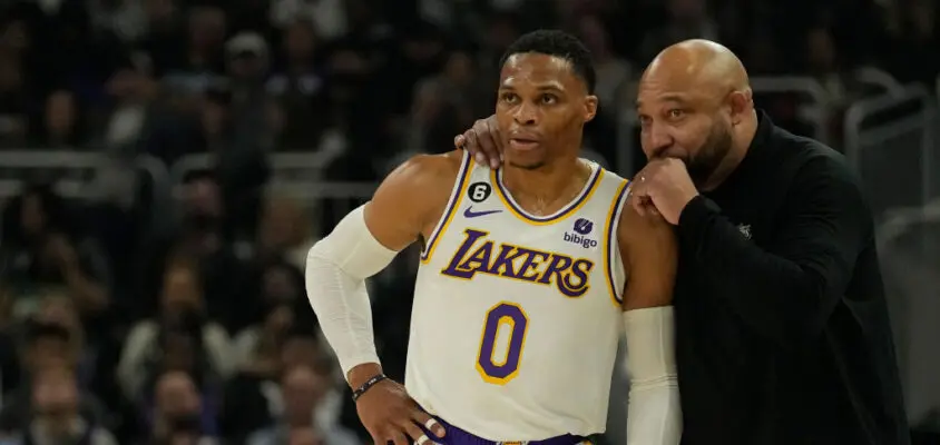 MILWAUKEE, WISCONSIN - DECEMBER 02: Russell Westbrook #0 of the Los Angeles Lakers talks with head coach Darvin Ham during the first half against the Milwaukee Bucks at Fiserv Forum on December 02, 2022 in Milwaukee, Wisconsin.