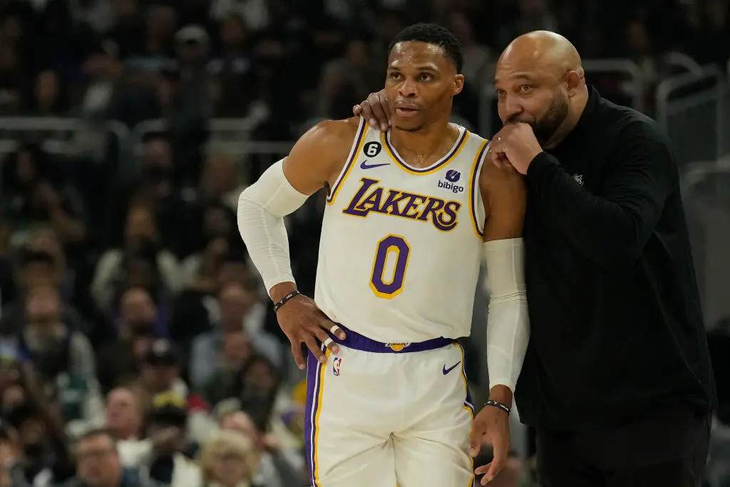 MILWAUKEE, WISCONSIN - DECEMBER 02: Russell Westbrook #0 of the Los Angeles Lakers talks with head coach Darvin Ham during the first half against the Milwaukee Bucks at Fiserv Forum on December 02, 2022 in Milwaukee, Wisconsin.