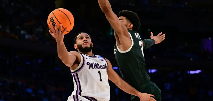 NEW YORK, NEW YORK - MARCH 23: Markquis Nowell #1 of the Kansas State Wildcats goes up for a layup guarded by Jaden Akins #3 of the Michigan State Spartans during overtime of the game during the Sweet Sixteen round of the 2023 NCAA Men's Basketball Tournament held at Madison Square Garden on March 23, 2023 in New York City