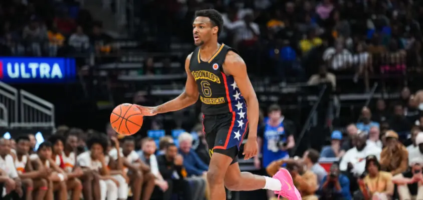 HOUSTON, TEXAS - MARCH 28: Bronny James #6 of the West team dribbles the ball during the 2023 McDonald's High School Boys All-American Game at Toyota Center on March 28, 2023 in Houston, Texas.