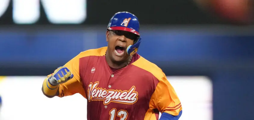 MIAMI, FLORIDA - MARCH 12: Salvador Perez #13 of Venezuela celebrates while rounding the bases after Anthony Santander hit a three run home run in the first inning against Puerto Rico at loanDepot park on March 12, 2023 in Miami, Florida